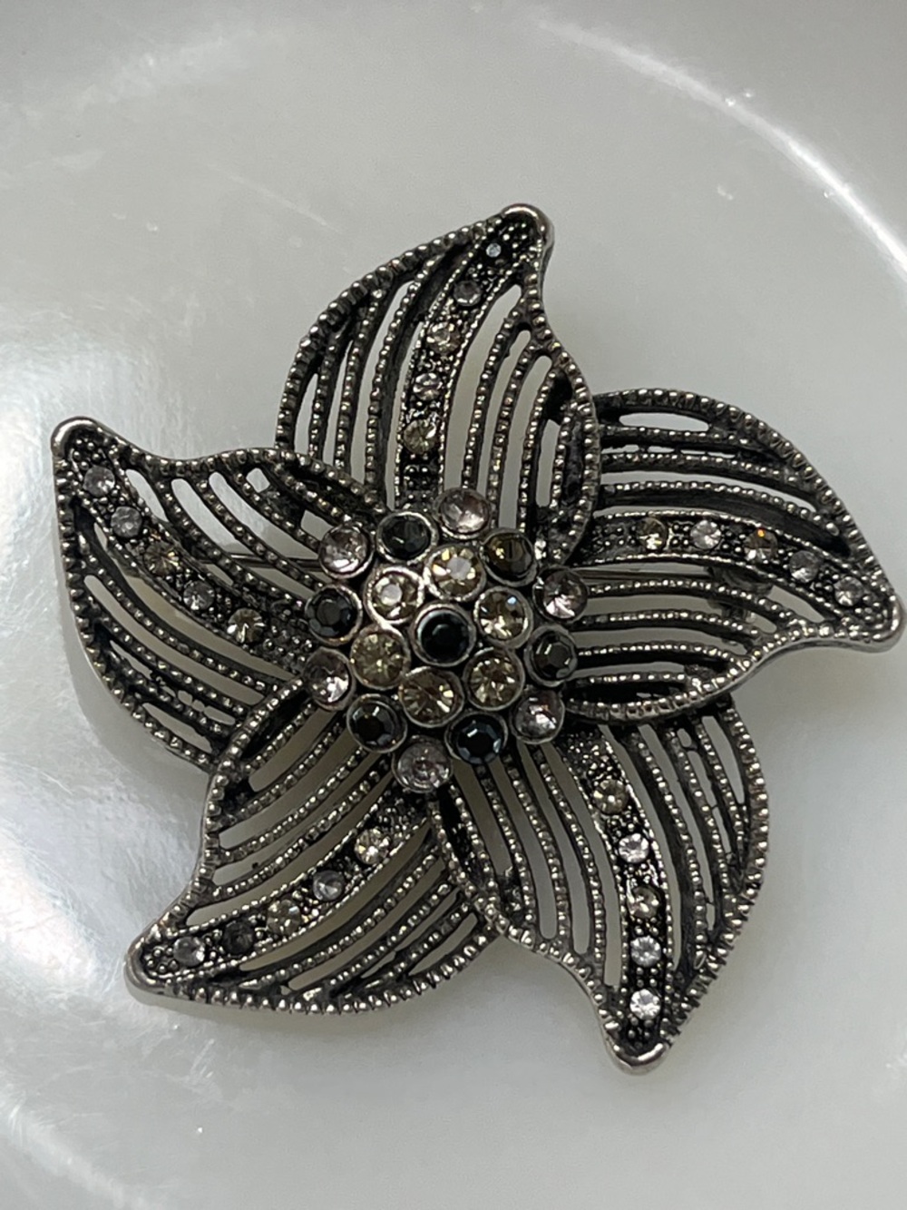 Vintage, Pinwheel Brooch in a Silver -Tone w/ Rhinestones